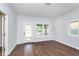 Spacious living room with hardwood floors and large windows at 906 N Parker Ave, Indianapolis, IN 46201