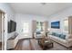 Bright living room with hardwood floors and fireplace at 906 N Parker Ave, Indianapolis, IN 46201