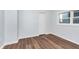 Simple bedroom with hardwood floors and a closet at 906 N Parker Ave, Indianapolis, IN 46201