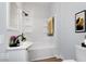Updated bathroom with a tub/shower combo, white vanity, and modern fixtures at 906 N Parker Ave, Indianapolis, IN 46201