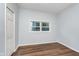 Well-lit bedroom with hardwood floors and a closet at 906 N Parker Ave, Indianapolis, IN 46201