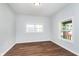Bright bedroom with hardwood floors and neutral walls at 906 N Parker Ave, Indianapolis, IN 46201