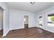 Living room with hardwood floors and access to other rooms at 906 N Parker Ave, Indianapolis, IN 46201