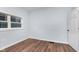 Well-lit bedroom with hardwood floors and a large window at 906 N Parker Ave, Indianapolis, IN 46201