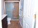 Bathroom with shower and dark brown vanity at 450 Kindig Rd, Indianapolis, IN 46217