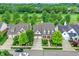 Aerial view of a luxury home community with houses and a golf course at 15482 Bridgewater Club Blvd, Carmel, IN 46033