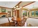 Bright dining area with hardwood floors and wood table at 15482 Bridgewater Club Blvd, Carmel, IN 46033