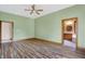 Bright bedroom with hardwood floors and en-suite bathroom access at 15482 Bridgewater Club Blvd, Carmel, IN 46033