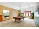 Game room with pool table, mural, and lighting at 15482 Bridgewater Club Blvd, Carmel, IN 46033