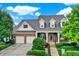 Two-story brick house with a two car garage at 15482 Bridgewater Club Blvd, Carmel, IN 46033