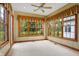 Sunroom featuring large windows and a ceiling fan at 15482 Bridgewater Club Blvd, Carmel, IN 46033