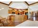 Bright kitchen boasts granite countertops and wood cabinets at 15482 Bridgewater Club Blvd, Carmel, IN 46033