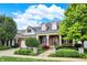 Brick house with a two-car garage and landscaped yard at 15482 Bridgewater Club Blvd, Carmel, IN 46033