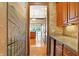 Butlers pantry with granite countertop and wine cooler at 15482 Bridgewater Club Blvd, Carmel, IN 46033