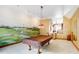 Spacious game room with pool table and golf mural at 15482 Bridgewater Club Blvd, Carmel, IN 46033