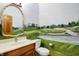 Powder room with golf course mural and elegant vanity at 15482 Bridgewater Club Blvd, Carmel, IN 46033