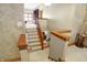 Upstairs hallway with staircase and library view at 15482 Bridgewater Club Blvd, Carmel, IN 46033