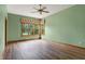 Serene bedroom with hardwood floors and a view of the backyard at 15482 Bridgewater Club Blvd, Carmel, IN 46033
