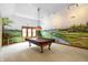 Game room with pool table and golf course mural at 15482 Bridgewater Club Blvd, Carmel, IN 46033