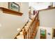 Elegant wooden staircase with detailed banister at 15482 Bridgewater Club Blvd, Carmel, IN 46033