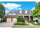 Brick house with a two-car garage and landscaped yard at 15482 Bridgewater Club Blvd, Carmel, IN 46033