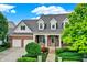 Two-story brick house with a two car garage at 15482 Bridgewater Club Blvd, Carmel, IN 46033