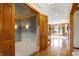 View through the home office to the living room and staircase at 15482 Bridgewater Club Blvd, Carmel, IN 46033