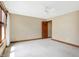 Well-lit bedroom with ceiling fan and door to hallway at 15482 Bridgewater Club Blvd, Carmel, IN 46033