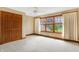 Spacious bedroom with large window, wood floors and double doors leading to a closet at 15482 Bridgewater Club Blvd, Carmel, IN 46033
