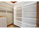 Large walk-in closet with built-in shelving at 15482 Bridgewater Club Blvd, Carmel, IN 46033