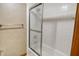 Bathroom with shower/tub and tiled walls at 15482 Bridgewater Club Blvd, Carmel, IN 46033