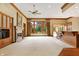 Spacious living room with fireplace and large windows offering abundant natural light at 15482 Bridgewater Club Blvd, Carmel, IN 46033