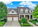 Two-story brick house with a two car garage at 15482 Bridgewater Club Blvd, Carmel, IN 46033