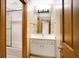 Clean bathroom with white vanity, mirror and shower/tub combo at 15482 Bridgewater Club Blvd, Carmel, IN 46033