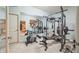 Basement home gym with various equipment including stationary bike and weight machine at 1053 Westview Point Dr, Columbus, IN 47201