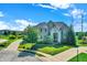 Brick house with a large yard and a circular driveway at 2929 Post Oak Ct, Westfield, IN 46074