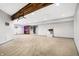 Finished basement with carpeted floors and a rustic accent wall at 2929 Post Oak Ct, Westfield, IN 46074
