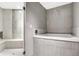 Bathroom with soaking tub and modern tile design at 2929 Post Oak Ct, Westfield, IN 46074