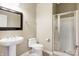 Clean bathroom with pedestal sink, toilet and shower at 2929 Post Oak Ct, Westfield, IN 46074