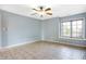 Bedroom with ceiling fan, window, and tiled floors at 2929 Post Oak Ct, Westfield, IN 46074