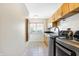 Laundry room with modern appliances and wood cabinets at 2929 Post Oak Ct, Westfield, IN 46074