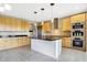 Modern kitchen with island, stainless steel appliances and light wood cabinets at 2929 Post Oak Ct, Westfield, IN 46074