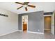 Bedroom with ceiling fan, en-suite bathroom access, and tiled floors at 2929 Post Oak Ct, Westfield, IN 46074