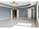 Large bedroom with tile floors, ceiling fan and window at 2929 Post Oak Ct, Westfield, IN 46074
