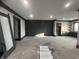 Spacious basement with dark gray walls and built-ins at 719 Wexford Hill Ct, Westfield, IN 46074