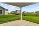Private backyard with covered patio and view of neighboring homes at 16910 Cattle Hollow Ln, Noblesville, IN 46060