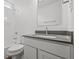 Modern bathroom with gray countertop, white cabinets, and a shower/tub combo at 16910 Cattle Hollow Ln, Noblesville, IN 46060