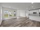 Open concept dining room with hardwood floors and sliding glass doors to patio at 16910 Cattle Hollow Ln, Noblesville, IN 46060