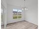 Light-filled dining area with wood-look flooring at 16910 Cattle Hollow Ln, Noblesville, IN 46060