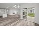 Spacious dining room with hardwood floors, fireplace, and patio access at 16910 Cattle Hollow Ln, Noblesville, IN 46060
